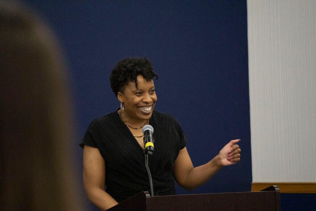 Professor Carla Shedd delivers her remarks to the sociology seniors from a podium