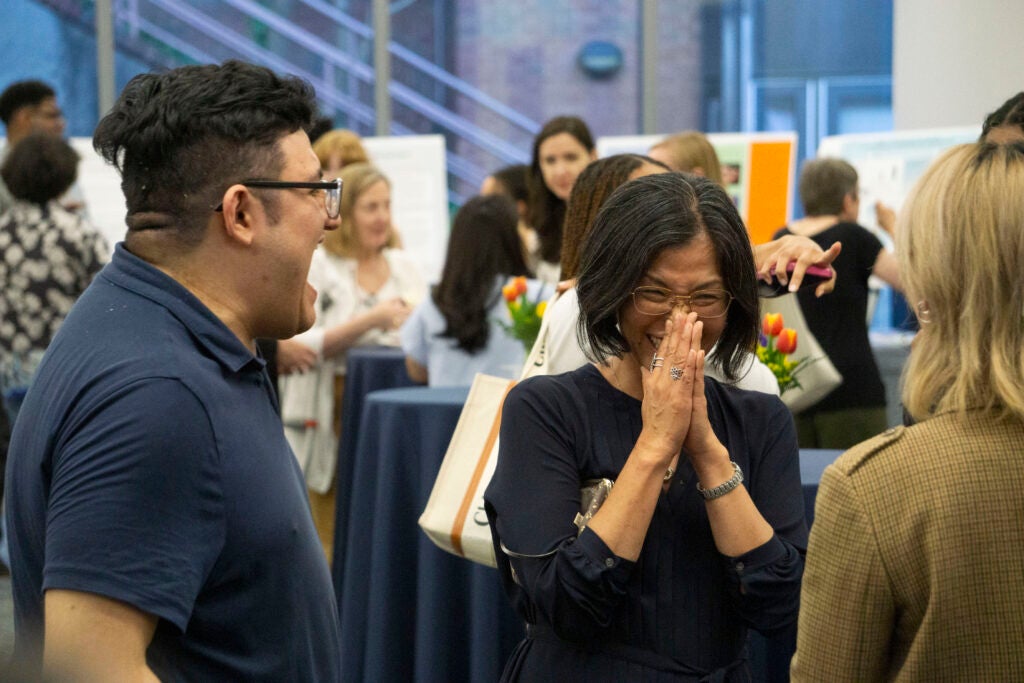 Professor Yuki Kato laughs with seniors Anndy Serrano-Marcillo and Linh Truong