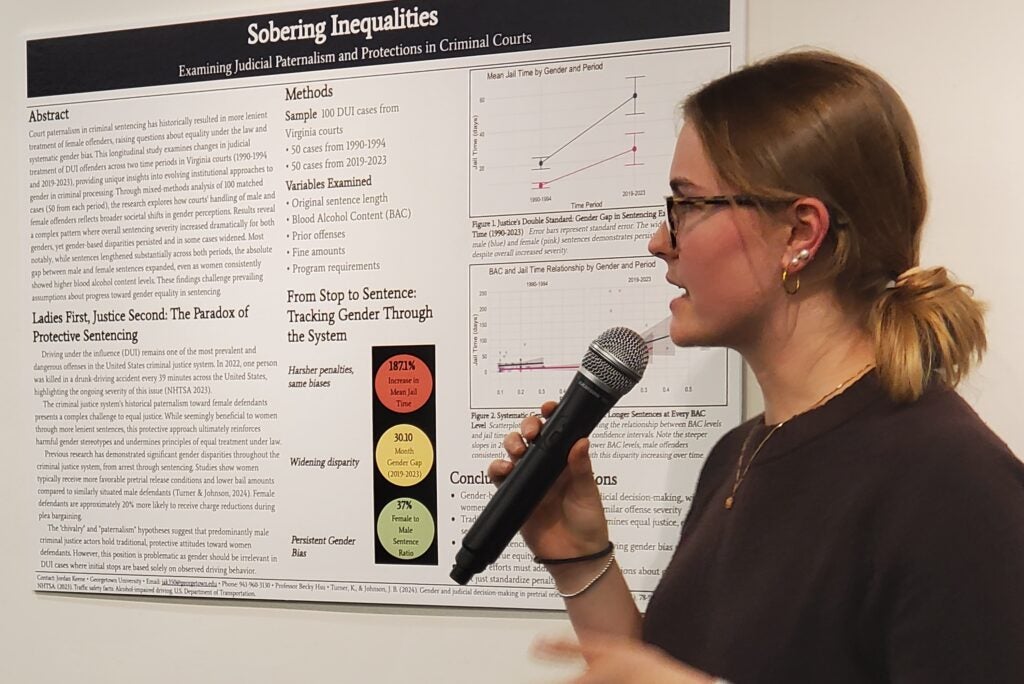 Jordan Keene presents her honors thesis at the 2025 Undergraduate Research Exhibition.