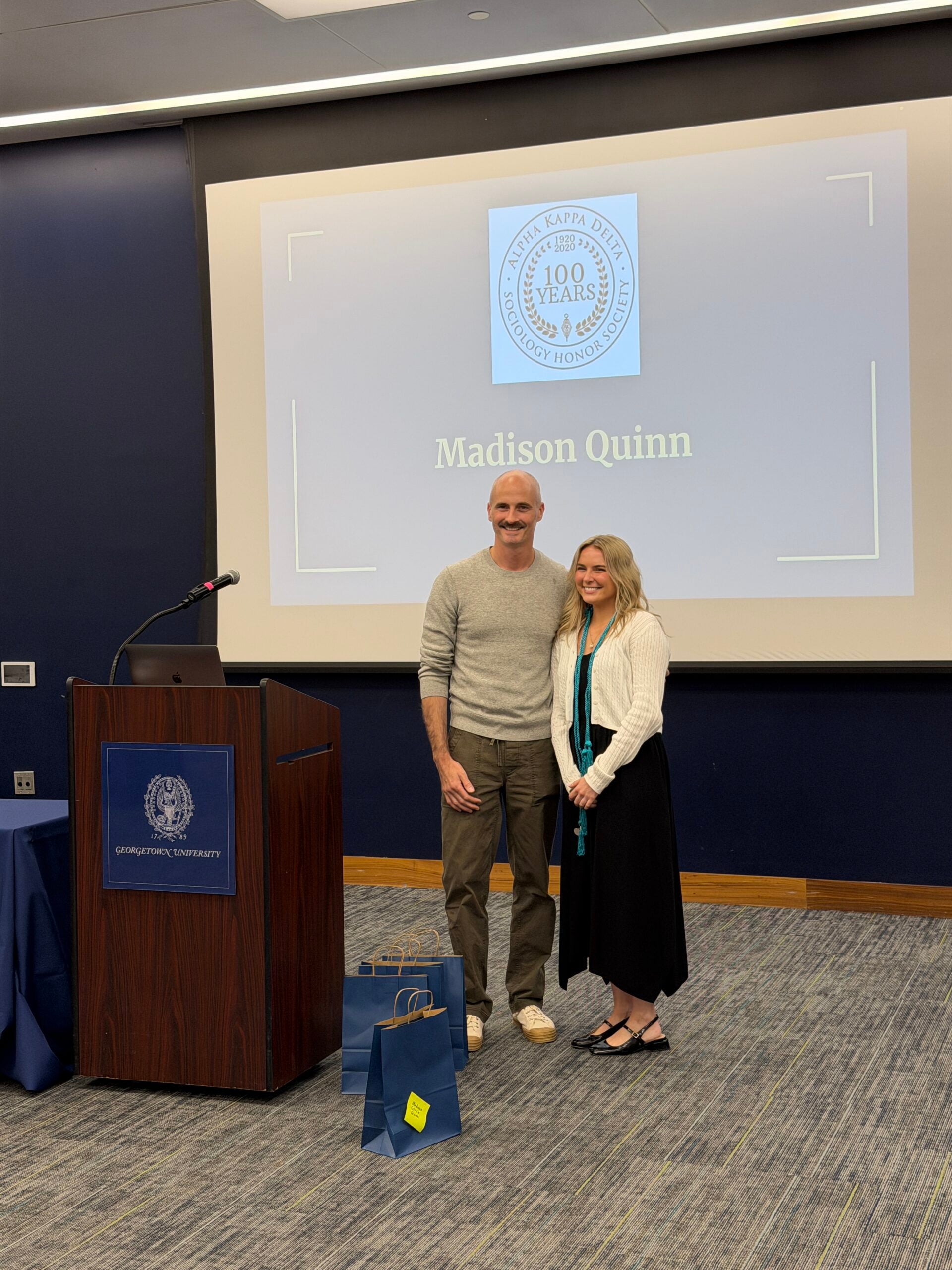 Inductee Madison Quinn and Professor Brian McCabe